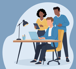 A diverse team collaborates in a modern office, working together on a project with a laptop and tablet, fostering teamwork and productivity