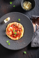 Exclusive spaghetti bolognese as culinary artistry on plate.