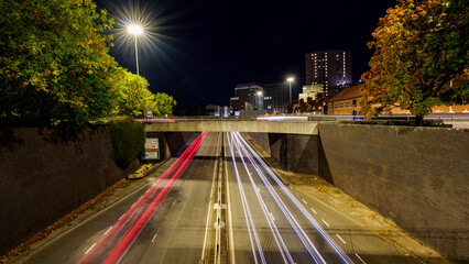 City highway at night with long exposure light trails
