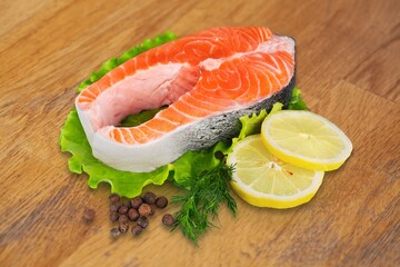 Raw tasty salmon fillets on desk