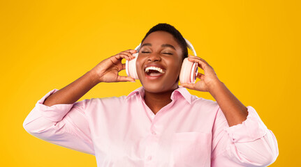 Music Lover. Overweight African American Female Listening To Favorite Song With Eyes Closed,...
