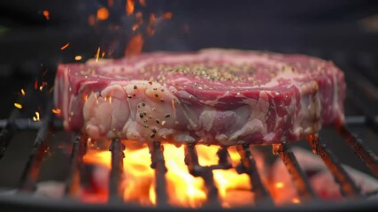 Close up raw rib eye steak on flaming barbecue grill for cooking, healthy, delicious, gourmet, advertisement, promo video, presentation.