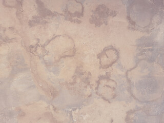 Background. Part of a beige wall with water stains after a flood. Space for creative text or advertising. Copy space 