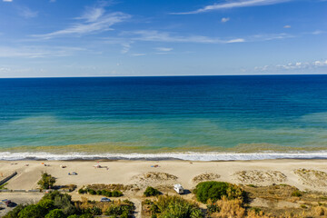  Aerial drone view of Lascari Beach, a scenic coastal area near the Madonie Mountains in northern Sicily, Italy, golden sand, turquoise Tyrrhenian Sea waters, and a peaceful Mediterranean landscape