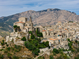 Obraz premium Aerial drone view of Petralia Soprana, a historic Sicilian mountain town with panoramic views of the Madonie Mountains,Petralia Soprana famous Church of Saint Mary of Loreto, Sicily, Italy