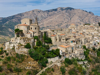 Obraz premium Aerial drone view of Petralia Soprana, a historic Sicilian mountain town with panoramic views of the Madonie Mountains,Petralia Soprana famous Church of Saint Mary of Loreto, Sicily, Italy