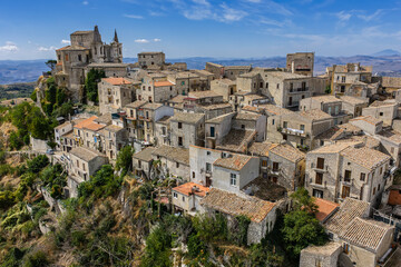 Fototapeta premium Aerial drone view of Petralia Soprana, a historic Sicilian mountain town with panoramic views of the Madonie Mountains,Petralia Soprana famous Church of Saint Mary of Loreto, Sicily, Italy