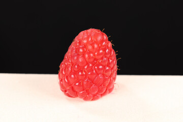 Fresh Red Raspberry Macro on Light and Black Background