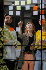 Creative brainstorming session in an office space with diverse team members sharing ideas and...