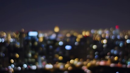 Blurred cityscape lights at night, bokeh effect on the horizon - Powered by Adobe