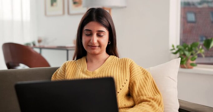 Creative, freelancer and woman with laptop, lounge and proofreading article on website and magazine. Remote work, journalist and person with tech for story, online and editing draft on couch in home