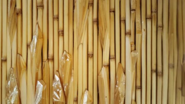 Close up of bamboo sticks with crystal like decorations for a textured background image design nature texture background video