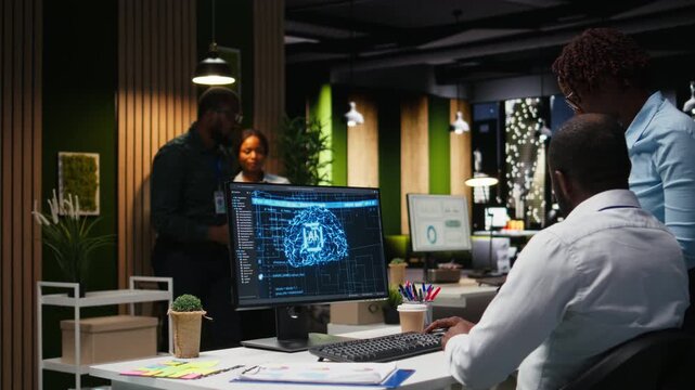 Black colleagues team using AI analytics platform for monthly data reports, reviewing neural networks algorithms and automation for business productivity. IT company representative at work. Camera A.