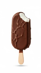 Obraz premium Chocolate covered ice cream bar with a bite taken out.