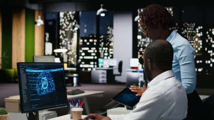 Black colleagues team using AI analytics platform for monthly data reports, reviewing neural networks algorithms and automation for business productivity. IT company representative at work. Camera B. - Powered by Adobe