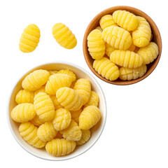 Overhead shot of three bowls of fresh, ridged dumplings, some isolated