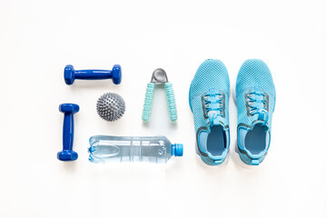 Flat lay of fitness sports equipment. Sneakers and dumbbells for gym. Wellness concept