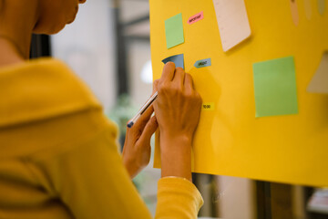 Creative brainstorming session with colorful sticky notes in a modern office setting during the morning
