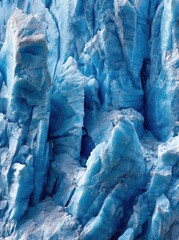 Close-up view of glacial ice showing textured, blue, and ridged icy formations