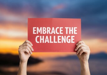 Embrace the challenge: A hand holding a red card that says Embrace the Challenge with a scenic background, a motivational image that symbolizes accepting new experience