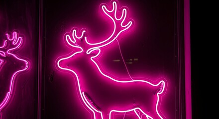 Bright pink neon reindeer sign glowing against a dark background adding festive holiday cheer to any space
