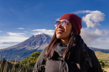 Woman standing on mountain enjoying mexico's popocatepetl volcano views