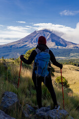 Hiker admiring popocatepetl volcano in mexico