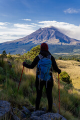 Hiker trekking iztaccihuatl mountain watching popocatepetl volcano