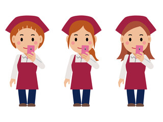 スマホを見る真紅のエプロンと三角巾の女性。その2