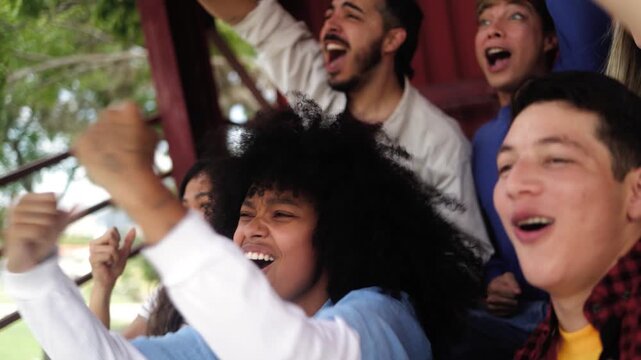 Sport fans support team at football stadium - Crowd of people have fun watching sports champion cup event - Entertainment concept