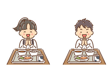 給食を食べようと手を合わせている小学生の男の子と女の子セット