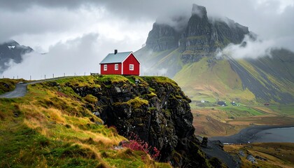 Red House on a Cliff Edge in the Lofoten Islands, Norway, with Dramatic Mountainous Landscape.