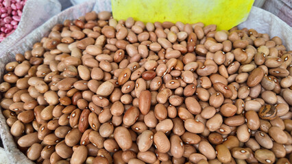 Freshly harvested pinto beans at a market stall