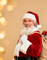 Cheerful Santa shoulders a burlap gift sack on warm bokeh