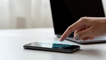 Fototapeta premium Hand interacting with smartphone screen