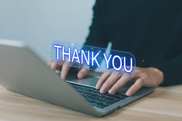 Business person typing on laptop with glowing Thank You text, representing digital communication, appreciation, customer relationship, online messaging, and modern social media interaction.