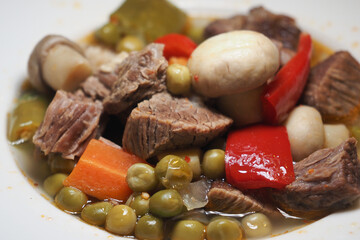 Delicious beef stew with vegetables served in a bowl