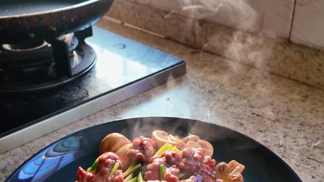A delicious home-cooked dish of stir-fried beef with straw mushrooms