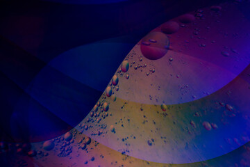 Close-up macro of blue oil and water bubbles