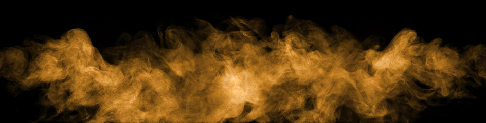 Orange gold dust smoke or fog effect isolated on a black background, perfect for fire design, energy concept, cinematic scene, motion effect, digital artwork, and creative visual editing.