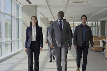 Ultra-realistic cinematic 8-second video of diverse professionals in business attire walking confidently through bright open-plan office with natural lighting