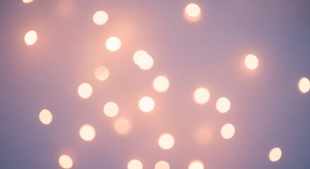 Abstract background of soft, warm, glowing bokeh lights against a dreamy pastel purple and pink backdrop.
