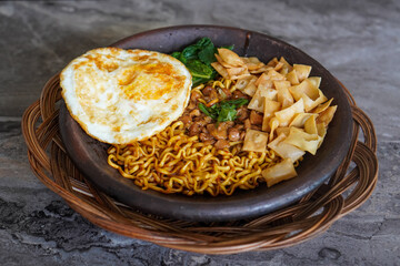 Grilled Chili Noodles, captured on October 8, 2025. Spicy stir-fried noodles charred over flames, topped with fresh herbs and chili, vibrant Indonesian street food scene