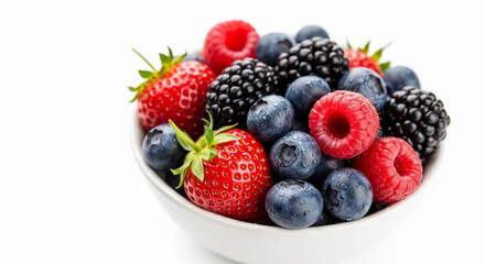 Macro shot of a bowl of mixed fresh berries, strawberries, blueberries, raspberries, with natural shine and juicy texture