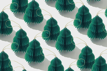 Minimal pattern of green paper Christmas ornaments shaped fie tree on white, style holidays design. Festive texture backdrop of paper Honeycomb baubles. Merry Christmas and Happy New Year concept.