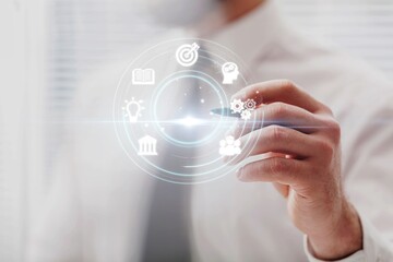 Skills Development. Businessman hold digital icons