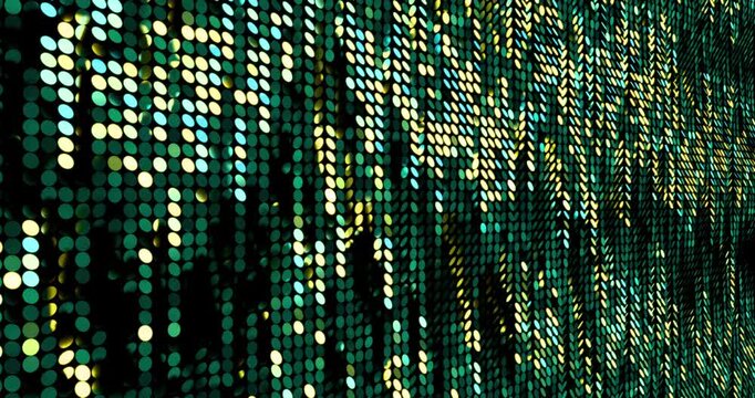 Green and gold sequins turn up in a random pattern. Side macro view of gorgeous waving pattern background. 4K 3D rendering loop animation.