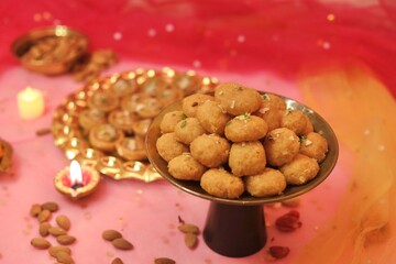 Balushahi or makkhan bada beautifully decorated with a festive celebration background 
