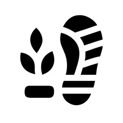 A vibrant close up macro photograph of a dewdrop reflecting the colorful sunrise sky on a green leaf