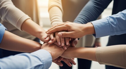 Diverse hands come together, symbolizing teamwork, collaboration, and unity in a professional setting.